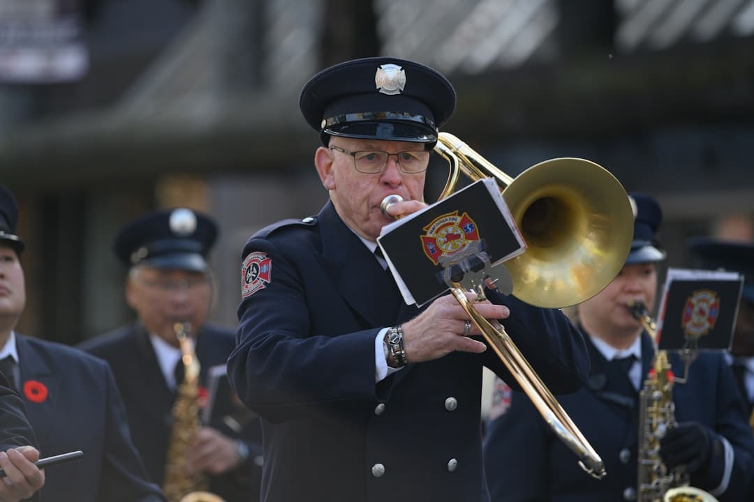 veteran service dog grants. Firefighter plays trombone in a marching band.