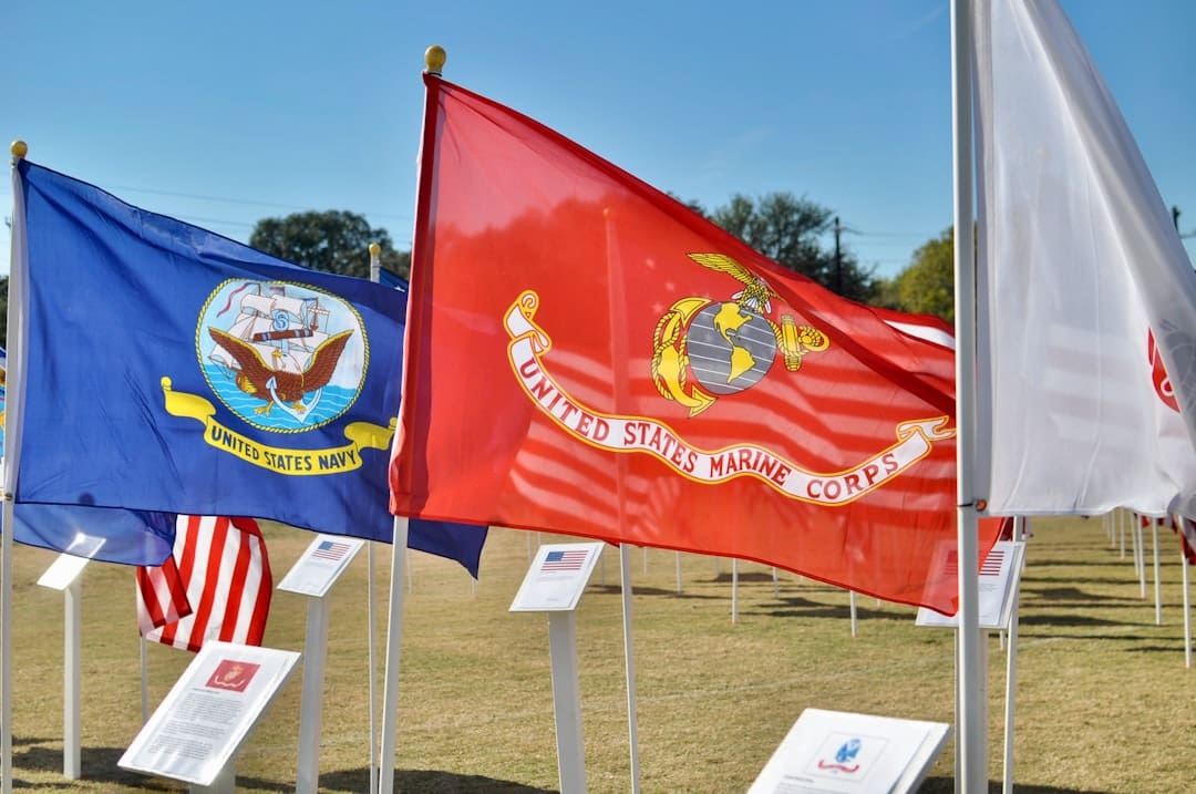 PTSD service dogs — red and yellow flag on white pole during daytime