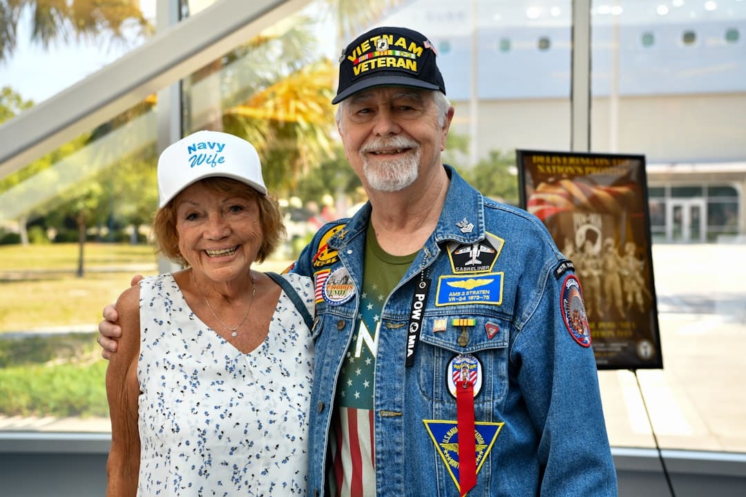 VA mental health — Couple wearing veteran hats and patches