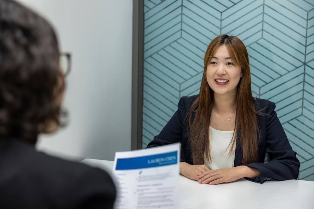 veteran suicide prevention — a woman sitting at a table with a piece of paper in front of her
